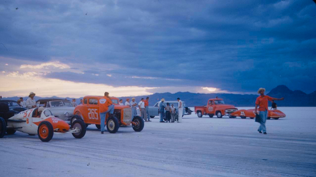 The Bonneville Speedway in 1954. This is image features several classic and eccentric cars, lined up to race each other on Utah's Salt Flats.